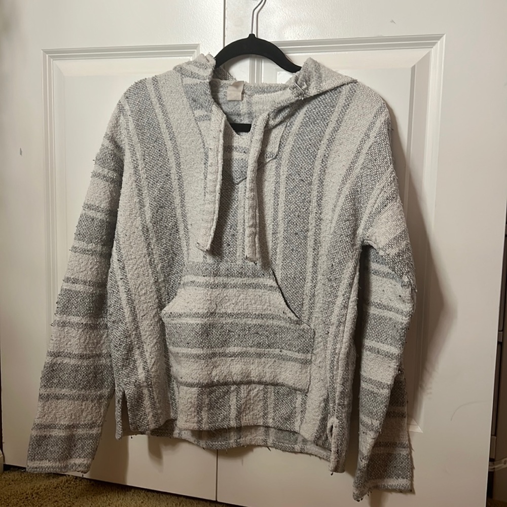 white and grey poncho